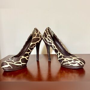 Satin cow print stiletto. Scuffing on the heels probably requires replacement.